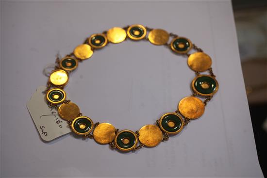 A Chinese high carat gold and jadeite suite of jewellery, comprising a necklace, bracelet and pair of drop earrings,